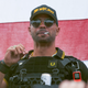 In this Sept. 26, 2020, file photo, Proud Boys leader Henry “Enrique” Tarrio wears a hat that says The War Boys during a rally in Portland, Ore. Tarrio, has been sentenced to five months in jail. Tarrio was convicted of burning a Black Lives Matter banner that was torn down from a historic Black church in downtown Washington and for bringing two high-capacity firearm magazines into the nation’s capital two days before the Jan. 6 riot.